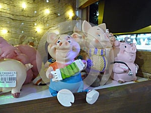 Funny little pigs are waiting for buyers. Souvenirs for the new year 2019.