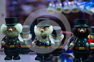 Funny little statues. View of traditional Tallinn Souvenirs miniature toys of the old town in the souvenir shop of the Old town,