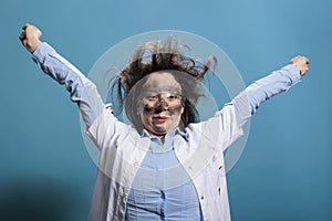 Funny looking scientist with messy hair and dirty face recovering from dangerous chemical explosion