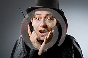 Funny magician man with wand