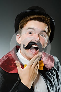 The funny magician man wearing tophat