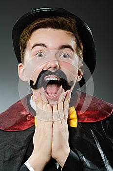 The funny magician man wearing tophat