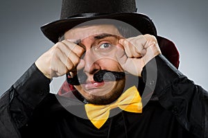 The funny magician man wearing tophat