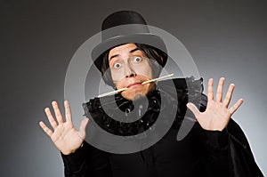 The funny magician wearing cylinder hat
