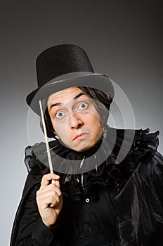 The funny magician wearing cylinder hat