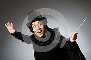 The funny magician wearing cylinder hat