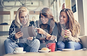 Funny mail. Three best friends using digital tablet together.