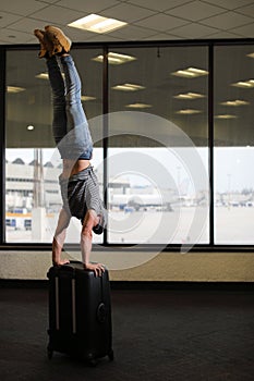 Funny man in airport with suitcase