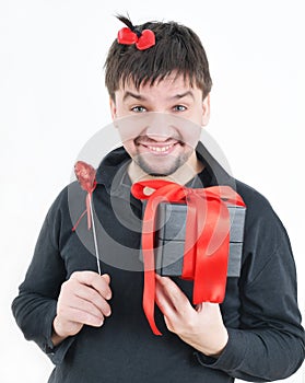 Funny man with box and heart in hands