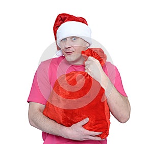 Funny man in cap Santa Claus with red bag of gifts on white background. File contains a path to isolation