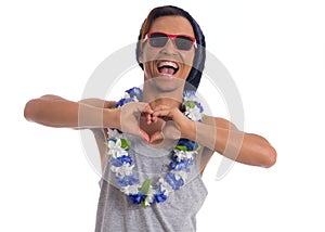 Funny man is enjoying the party. Young black man wears sunglasses, flower necklace and cap..