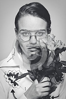 Funny man with flowers. old-time picture