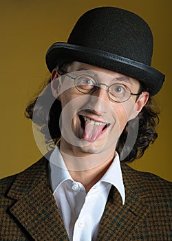 Funny man in glasses with long tongue photo