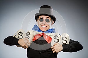 Funny man with money dollar sacks