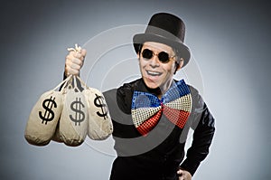 Funny man with money dollar sacks