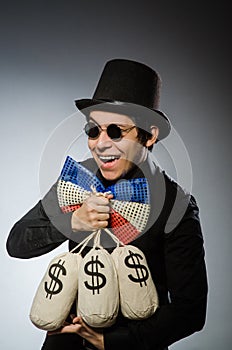 Funny man with money dollar sacks