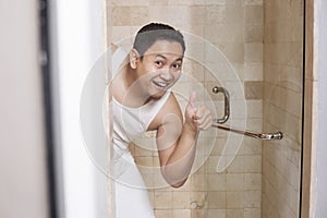 Funny Man Smiling in Bathroom