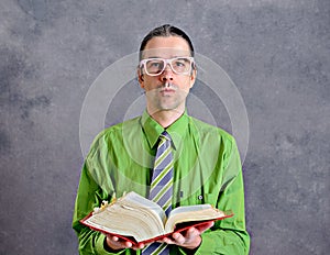 Funny man with statute book and pink glasses