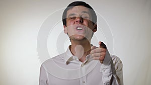 Funny man taunts, on a gray background