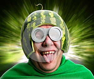 Funny man with watermelon helmet and googles