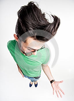 Funny man with wierd hairstyle showing his palm - wide angle