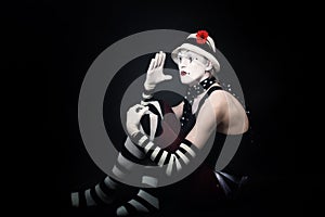 Funny mime on black background
