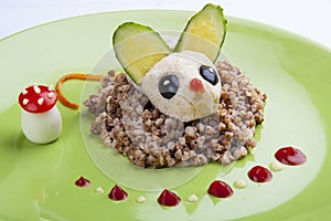 Funny mouse - chicken cutlet on buckwheat porridge. Meals for children