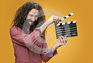 Funny nerd holding a clapperboard