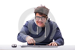 The funny nerd man working on computer isolated on white