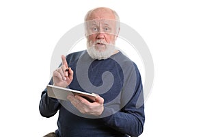 Funny old man using tablet computer isolated on white