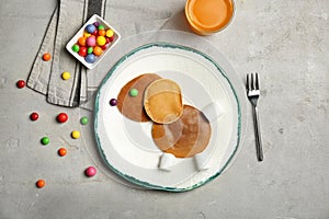 Funny pancakes for kids breakfast on table