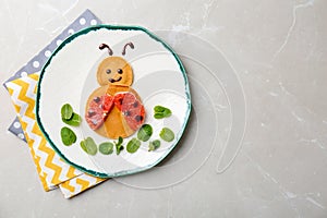 Funny pancakes for kids breakfast on table