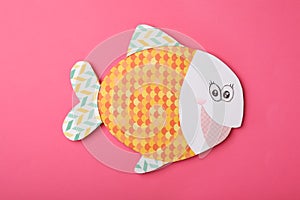 Funny paper fish on pink background. April Fool`s Day