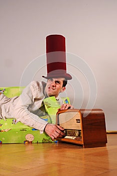 Funny picture of a man with old radio device