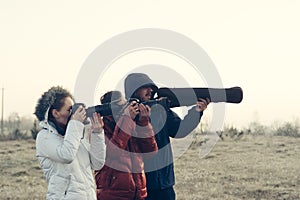Funny picture! Photographers with cameras and tripod making outdoor landscape picture