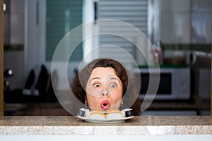 Funny picture of woman with Sushi at the kitchen. Fun, joke and humor concept.