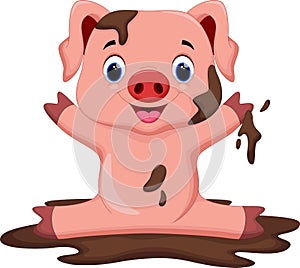 Funny pig playing in the mud