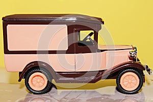 Funny pink vintage toy car side view