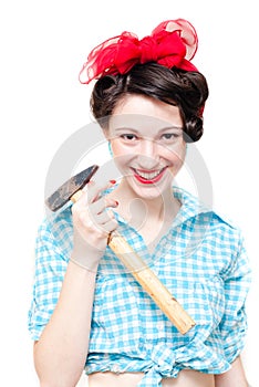 Funny pinup woman holding hammer