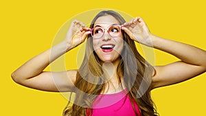 Funny portrait of excited girl wearing glasses eyewear. Closeup portrait of young woman making funny face expression  on