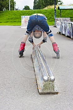 Funny Preschool Aged Rollerskater In Protection Fooling In P