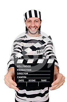 Funny prison inmate with movie board isolated