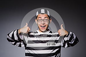 Funny prisoner isolated on gray