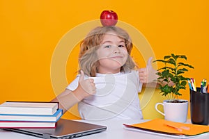 Funny pupil. Nerd school kid isolated on studio background. Clever child from elementary school with book. Smart genius