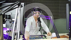 funny radio dj in sleep mask and cosmetic patches on broadcast