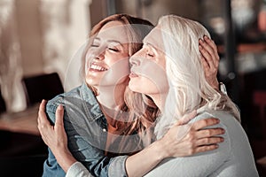 Funny relatives smiling with their eyes closed