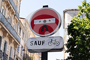 funny road no entry sign customized with an icon of a prisoner man in french city street