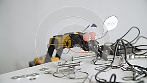 Funny Robot says I`m OK. Experiment with Intelligent Manipulator. Industrial Robot Model with Funny Face