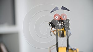 Funny Robot is Shaking Head to Say NO. Experiment with Intelligent Manipulator. Industrial Robot Model with Funny Face