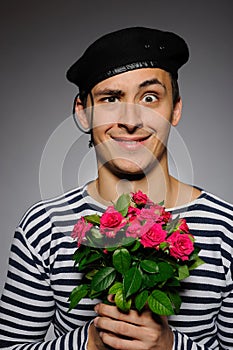 Funny romantic sailor man holding rose photo